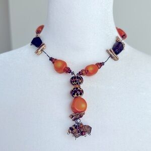 Fashion necklace with a combination of glass beads in various shapes and colors.